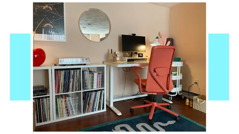 Coral colored Verve Chair stationed at desk inside of modern home office.