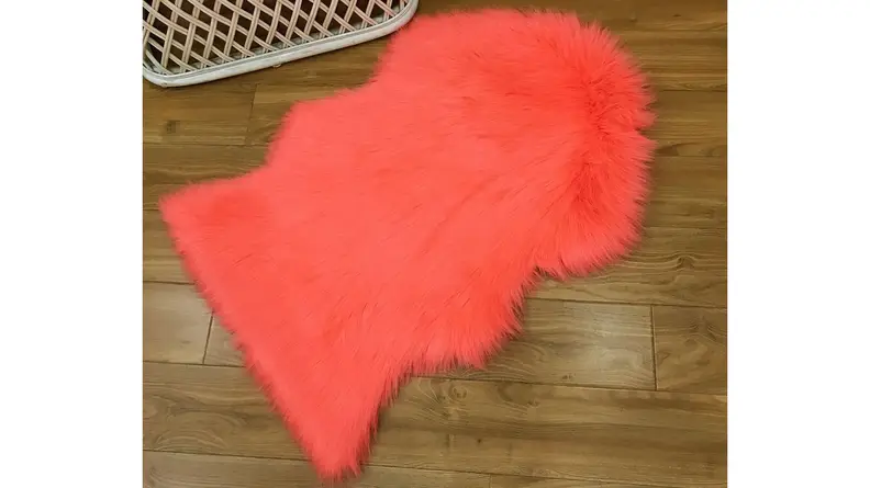 Whether you use it on the floor or toss it over the back of the couch,  this coral throw is ultra-soft.