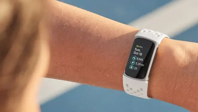 Person wearing smart watch on wrist.