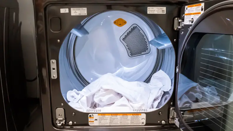The interior of the LG DLEX7900BE dryer's drum, filled with laundry.