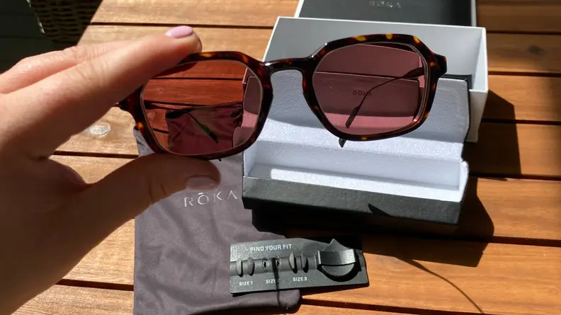 Roka sunglasses on a patio