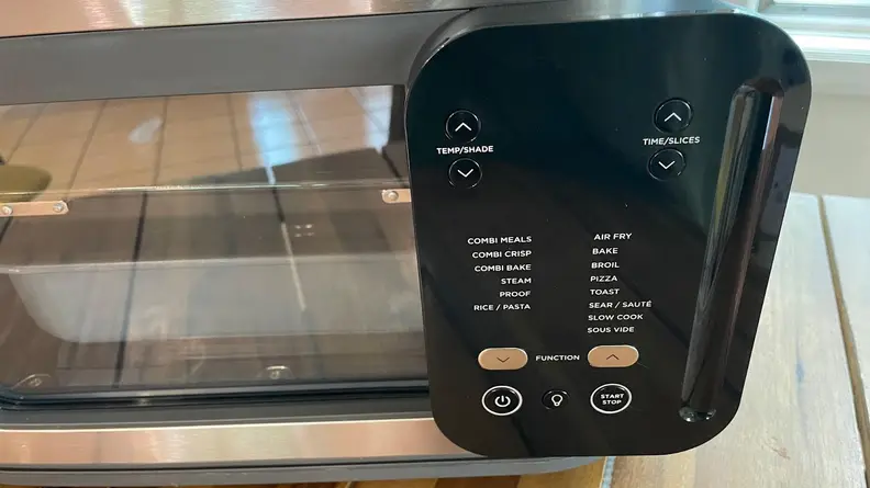 A close-up view of the settings menu on the Ninja Combi All-in-One Multicooker.