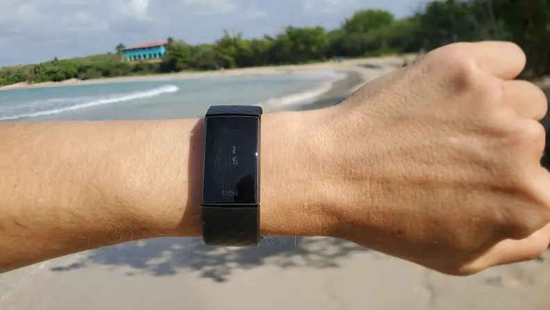 Fitbit Charge 4 on a wrist outdoors