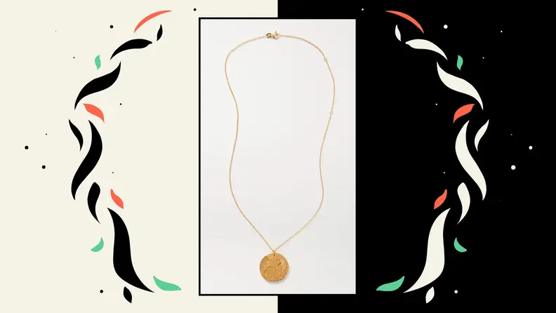 A gold necklace with a lion pendant.