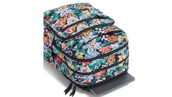 The Vera Bradley Signature Cotton XL Campus Backpack on a white background, with a laptop peeking out the top.