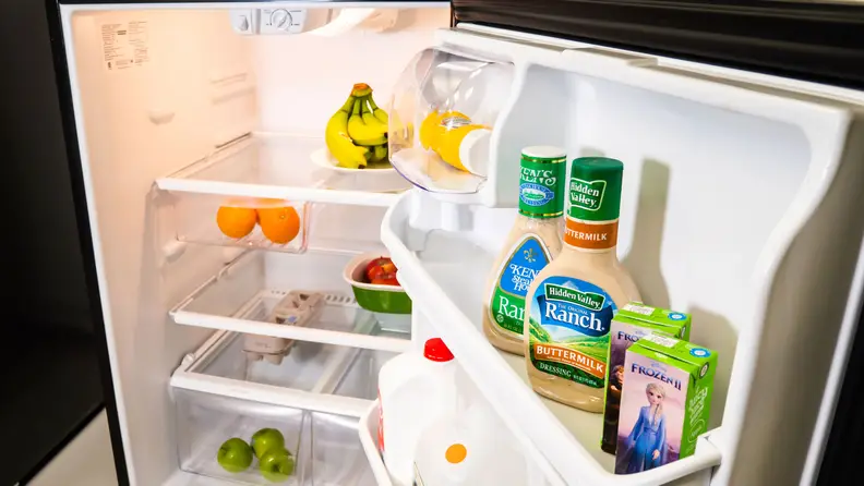 A shot of the interior of the Frigidaire FFTR2021TS top-freezer refrigerator's main compartment, filled with groceries for scale.