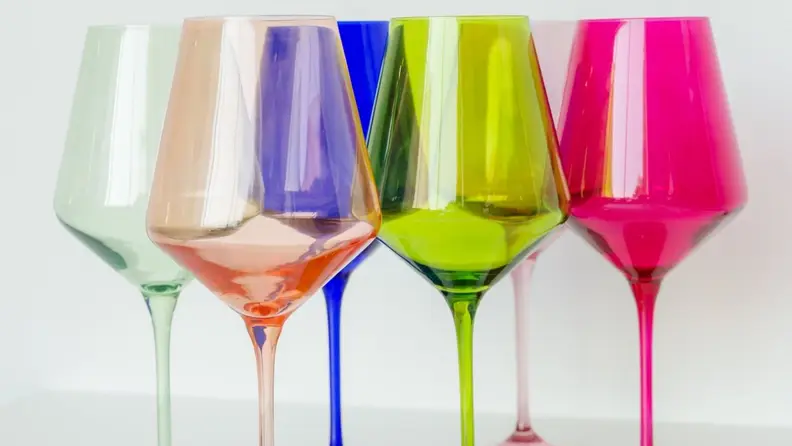 Six wine glasses, each in different shades including seafood green, light pink, dark blue, chartreuse, violet, and fuchsia.