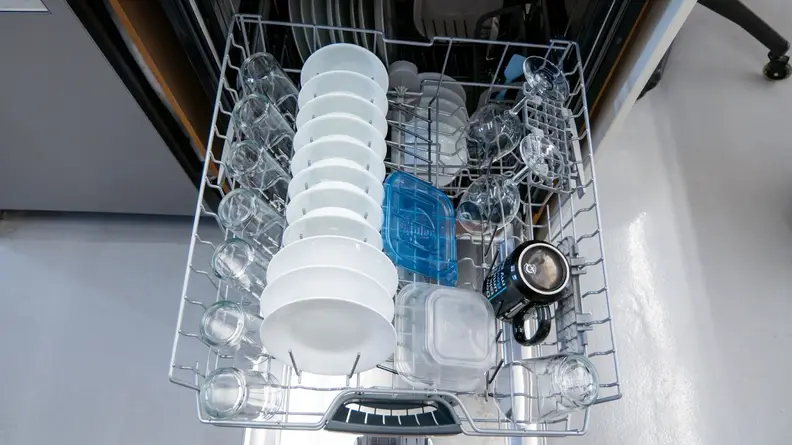 A close-up of the Bosch dishwasher's upper rack, which is loaded up with perfectly clean dishes.