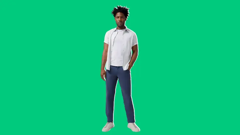 Person wearing a white shirt and blue lululemon ABC classic-fit pants on a green background