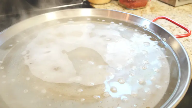 Adding white vinegar can help remove the anti-rust coating.