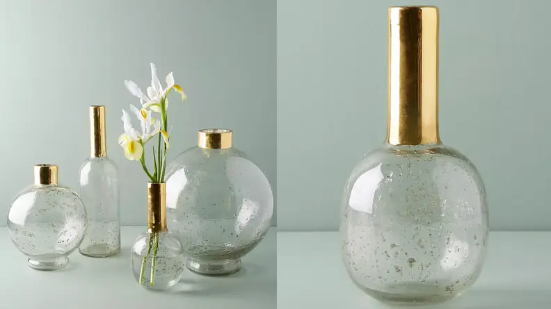 A collection of gold rimmed vases.