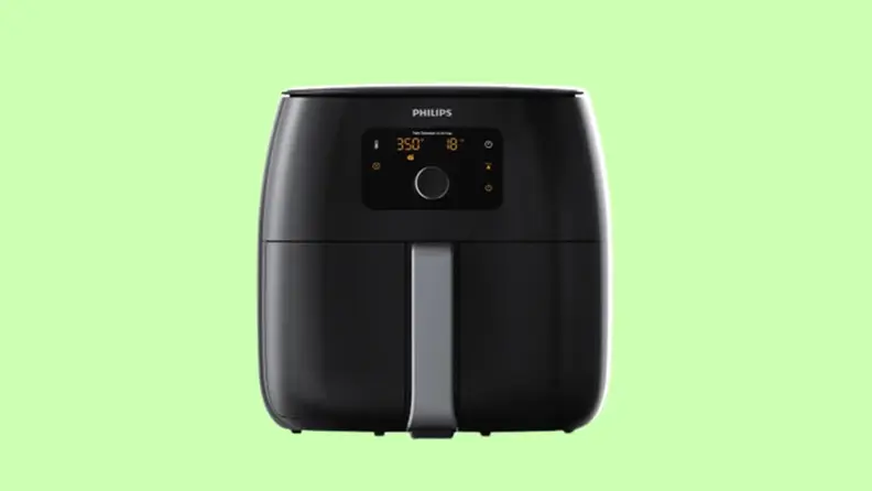 Phillips air fryer on a light green background