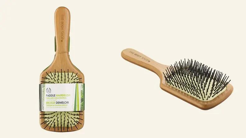 A bamboo paddle brush from The Body Shop.