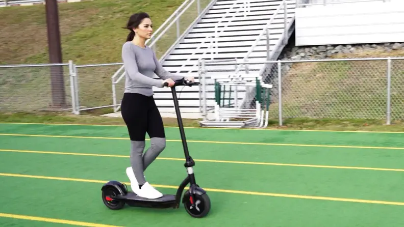 A person works out on a Hover-1 outside.