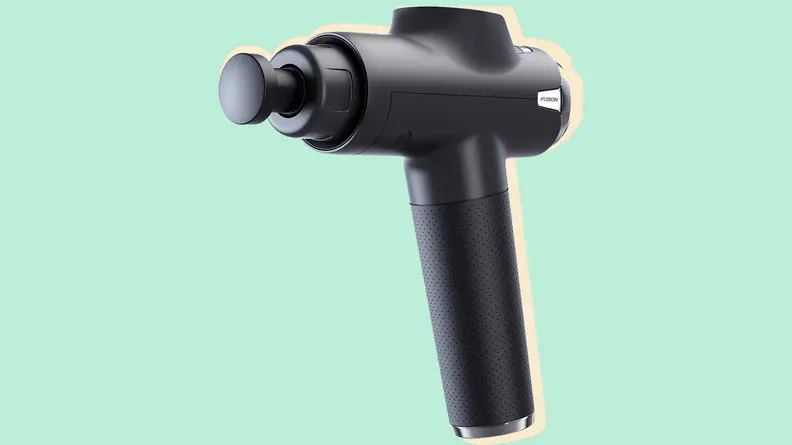 Massage gun on a green background