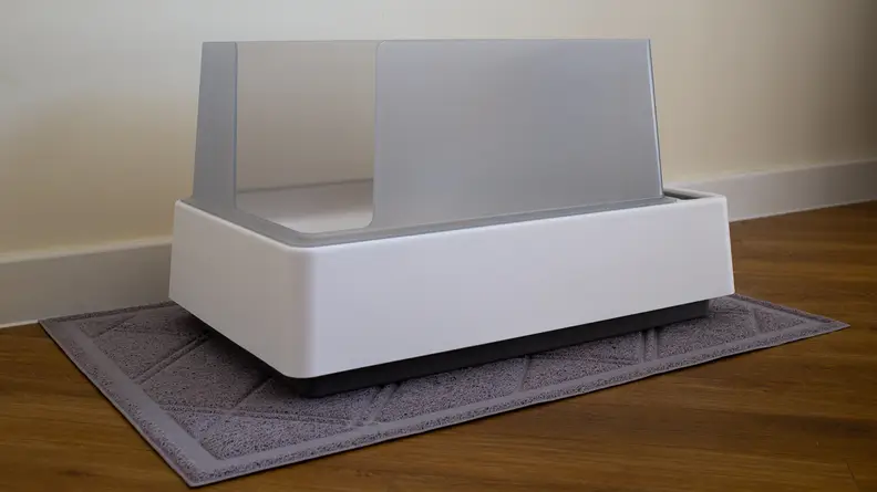 The Tuft and Paw Cove litter box against a white wall.