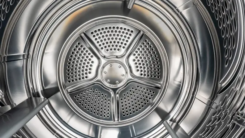 A close-up of the Frigidaire FFRE4120SW dryer's stainless steel drum.