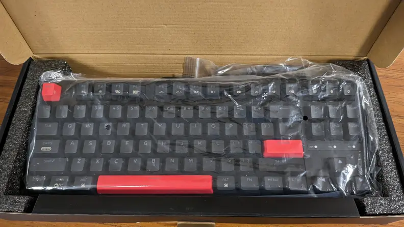An overhead view of the Keychron C3 Pro while still in its plastic wrapping.