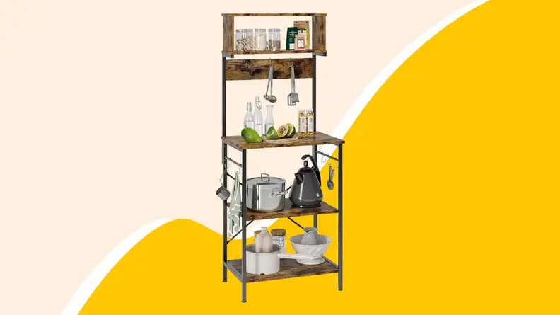 Wooden shelf with hooks and plates on top.