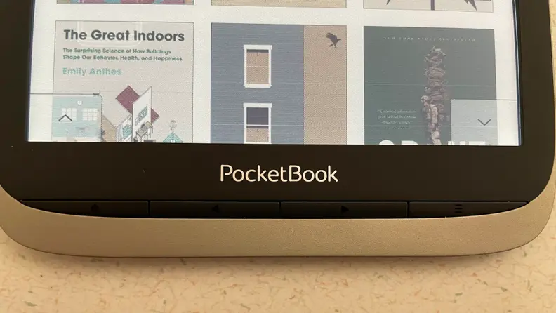 A close-up of the four hardware buttons on the InkPad Color's front, for page navigation, menu triggers, and going back to the home screen.