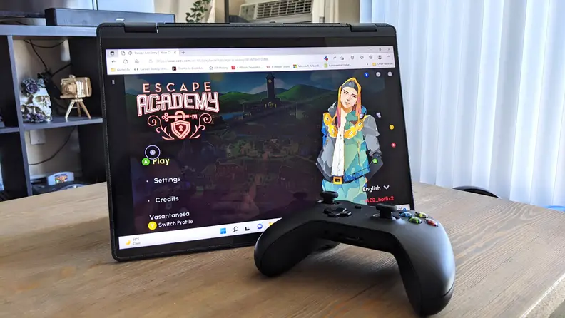 The Lenovo Yoga 6 stood up on a desk with an Xbox controller in front of it.