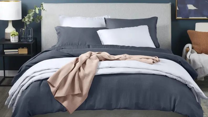 A set of Casper Hyperlite sheets on a bed.