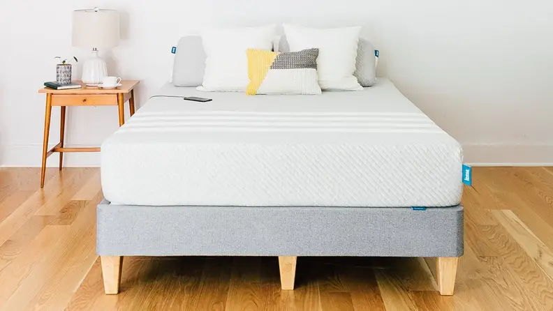 a leesa mattress on a gray bed frame