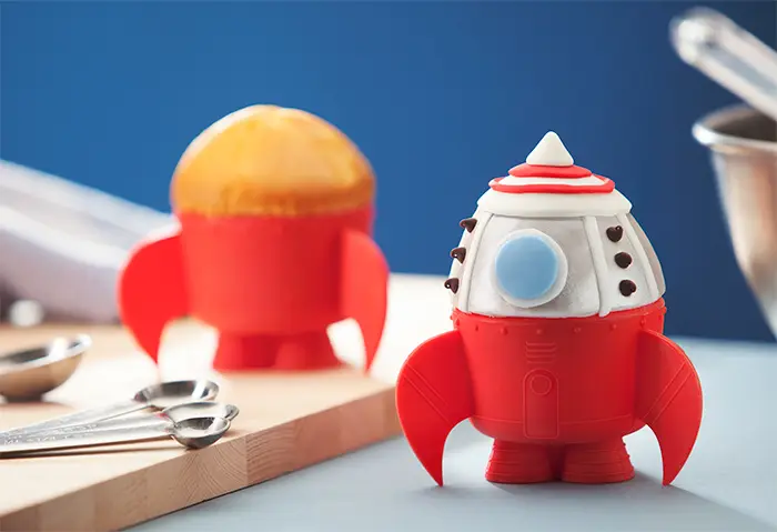 This rubber rocket will hold your muffin for you.