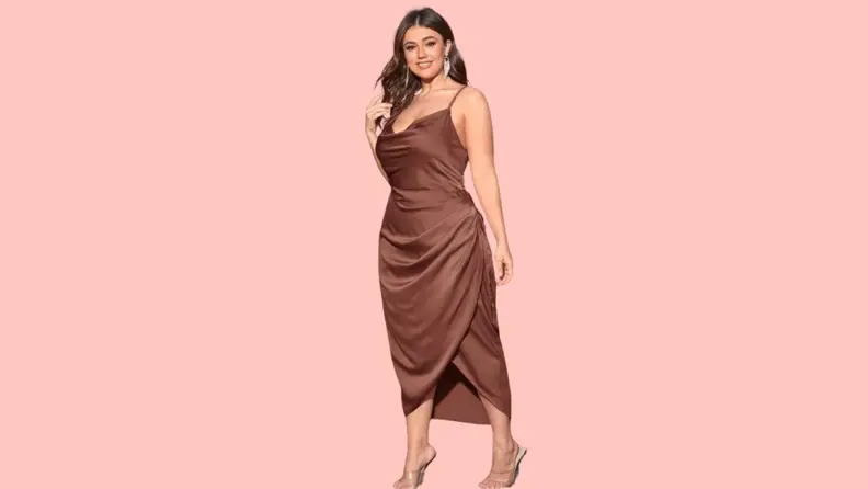 A model wearing a brown camisole dress.