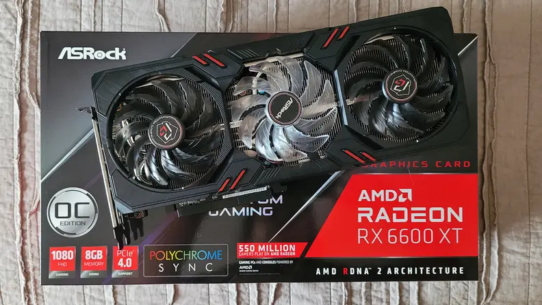 An AMD graphics card on top of its packaging.