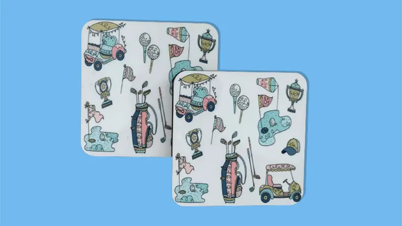 Kitschy golf coasters on a blue background.