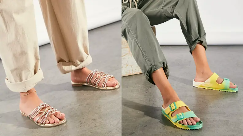 Bright colored sandals on women's feet.