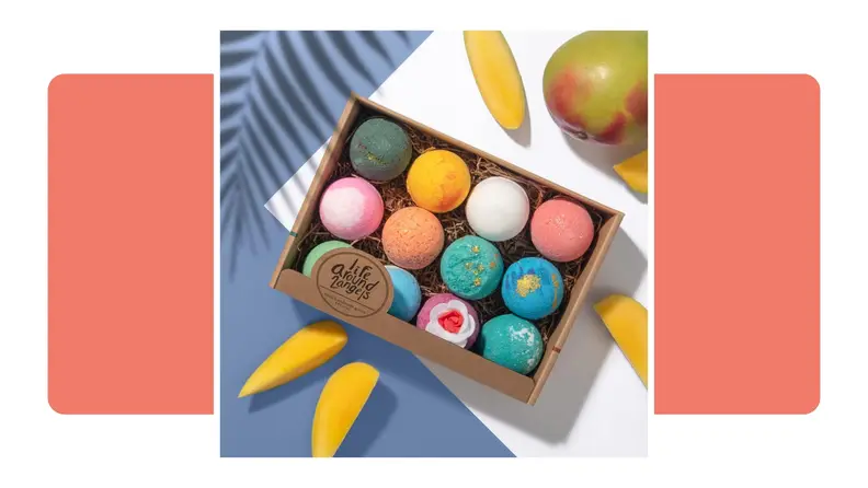 A box filled with 12 colorful LifeAround2Angels Bath Bombs.
