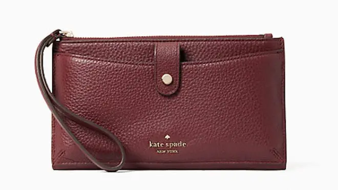 Burgundy colored leather wristlet from Kate Spade.