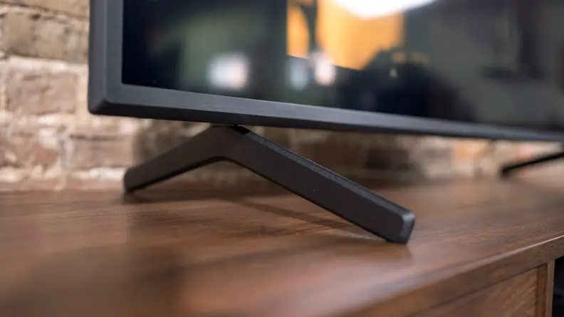 A close-up of the Sony X80J's wide-set, angular feet