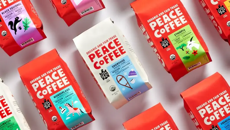 Several packets of peace coffee laid out on a white background