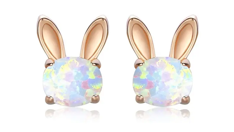Gold bunny-shaped earrings with shimmering opal centers.