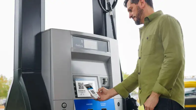 Customer using Sam's Club app to pay for gas at the pump