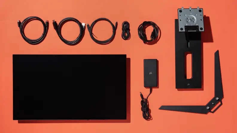 The contents of the Corsair Xeneon 27QHD240, including the monitor, stand and cables.