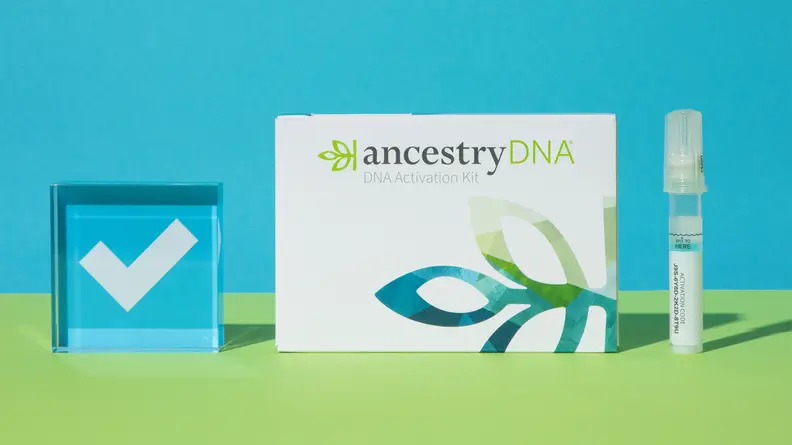 AncestryDNA kit on a blue and green background