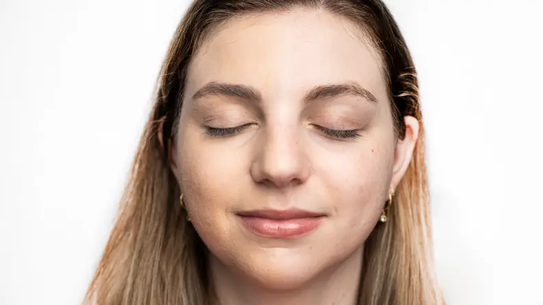 The author wearing the Covergirl TruBlend Undercover Concealer on the right side of her face.