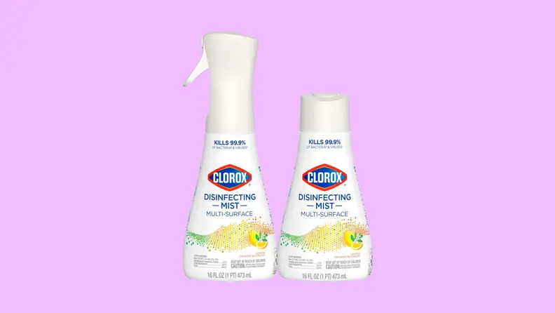 Two white bottles of Clorox Disinfecting Mist standing side by side on a purple background.