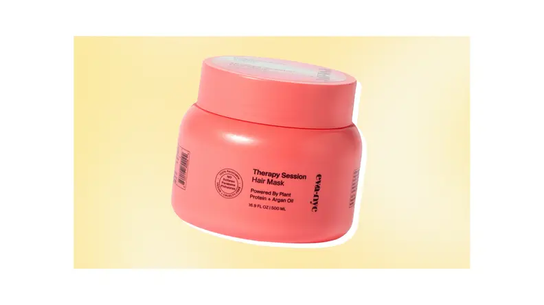 A pink tub of Eva NYC hydrating hair mask against a yellow background.