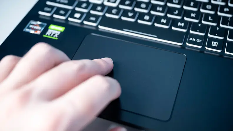 person uses the trackpad