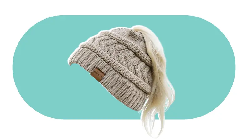 A knit beanie with a hole on the top to accommodate for a ponytail hairstyle.