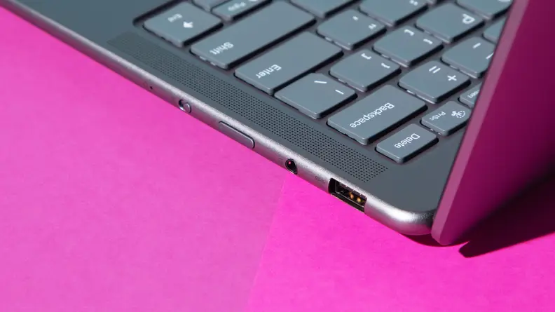 Close-up view of the various ports on the side of the Lenovo Slim 7 laptop.