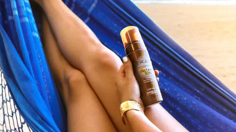 A photo of a woman's tan legs.