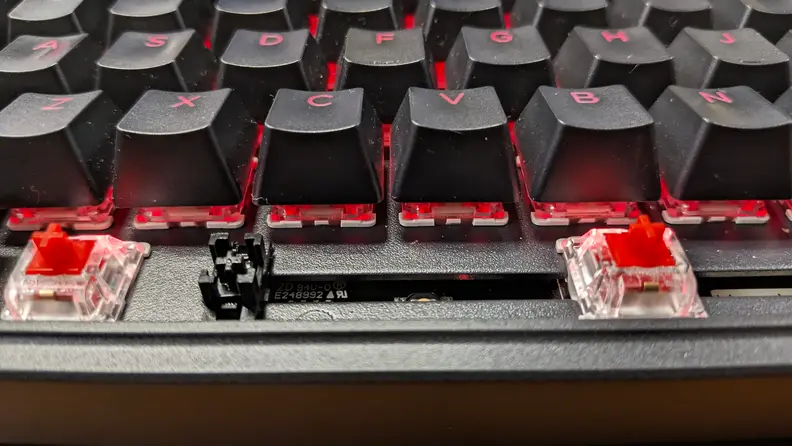 Close-up of the space bar of the Keychron C3 Pro with the keycap removed and switches exposed.