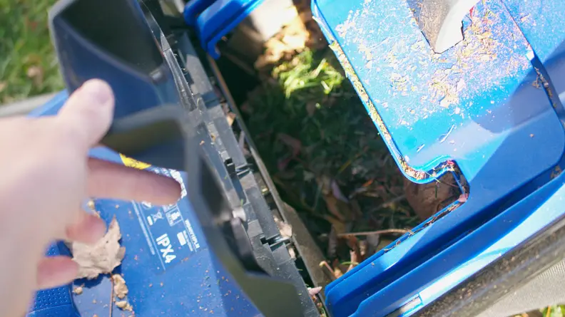 The mower bag of a blue lawn mower