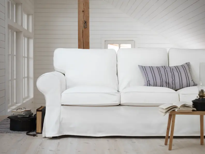 The slipcover on this neutral sofa is easy to keep clean.